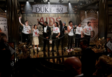Jonathan Bailey and Jelani Alladin protest Duke '86  re-election in Fellow Travelers for Showtime/Paramount +